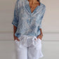 V-halset bluse med stjerneprint og knapper