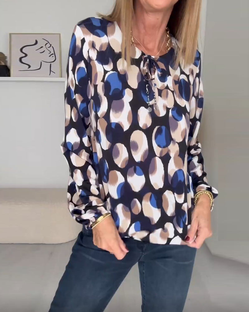 Elegant bluse med stropper og print